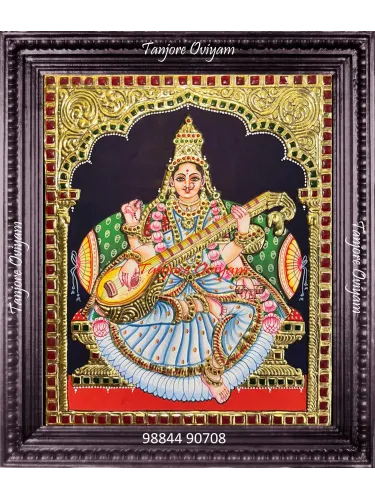 Saraswathi Tanjore painting featuring Goddess Saraswathi with veena, handcrafted using gold foil and traditional Thanjavur techniques